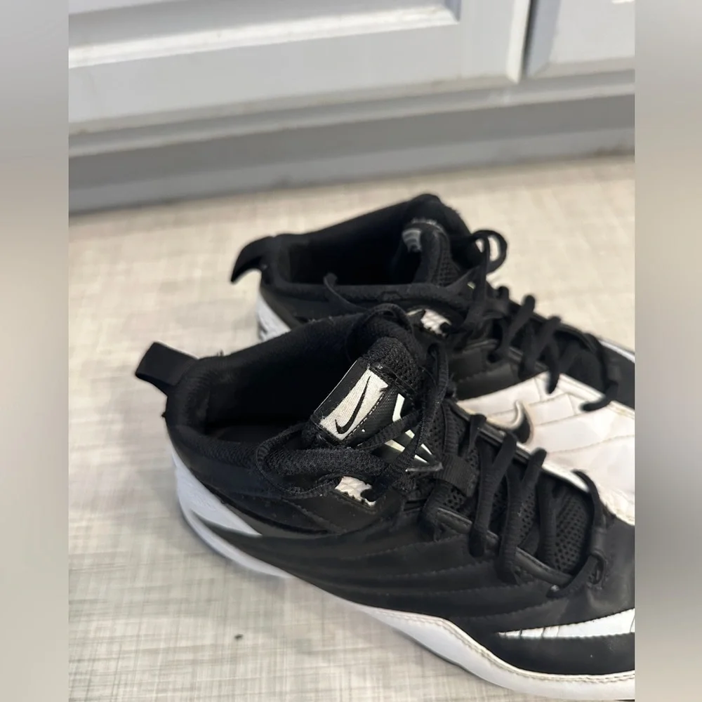 Nike Speed Shark 3/4 Football cleats in black and white.